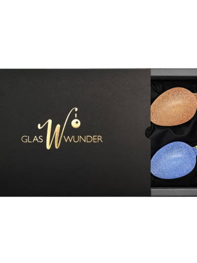 4er Set Ostereier aus Glas mit 6cm Durchmesser in transparenter und Glitter mit den Farben grün, orange, rot und blau in schwarzer Verpackung mit goldenem GlasWunder Logo