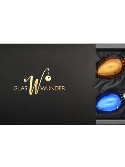 4er Set Ostereier aus Glas in transparent grün, orange, rot und blau mit 6cm Durchmesser in einer schwarzen Verpackung mit goldenem GlasWunder Logo